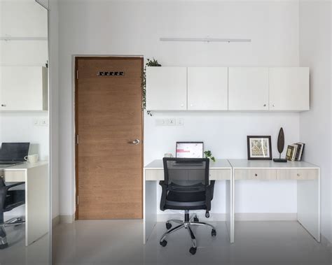 Modern Home Office Design with White Desk, Adjustable Chair, and Wall ...