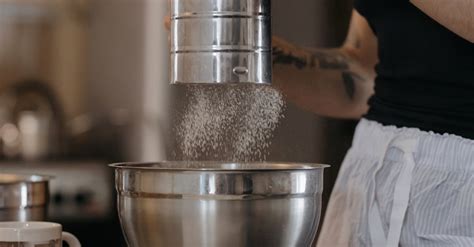 A Person Sifting Flour · Free Stock Photo