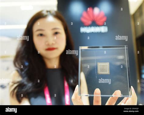 A Chinese hostess shows a fifth-generation solid state drive (SSD ...