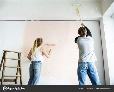 People Painting Walls