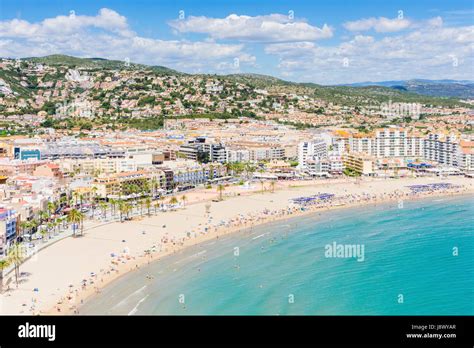 Peniscola Beach, the Playa Norte and waterfront hotels along the promenade of Peniscola Town ...