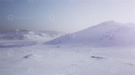 Aerial Landscape of snowy mountains and icy shores in Antarctica 5856227 Stock Photo at Vecteezy