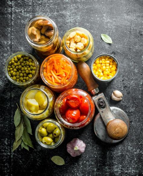 Premium Photo | Pickled food in glass jars