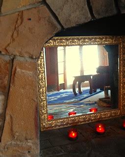 Dusty gold framed mirror in the fireplace, red candles, Ti… | Flickr