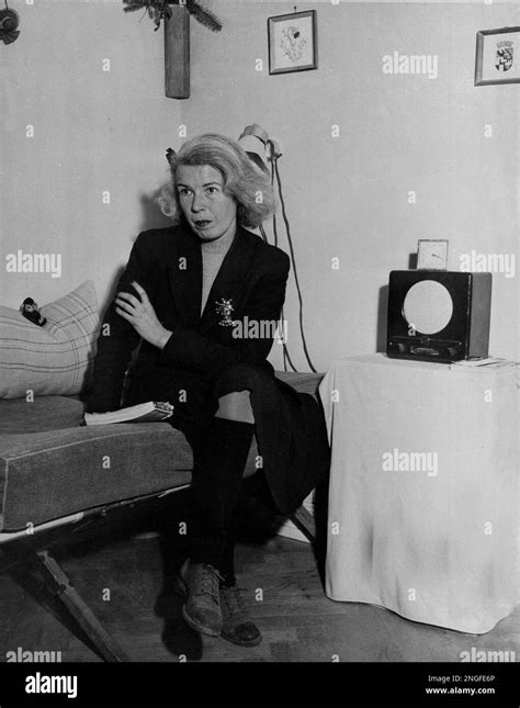 Mildred Gillars, wartime broadcaster known as "Axis Sally," listens to a radio in her prison ...