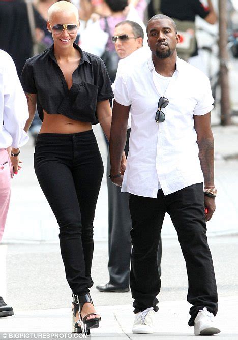 Kanye West upstaged by his cheeky girlfriend Amber Rose as she frolics ...