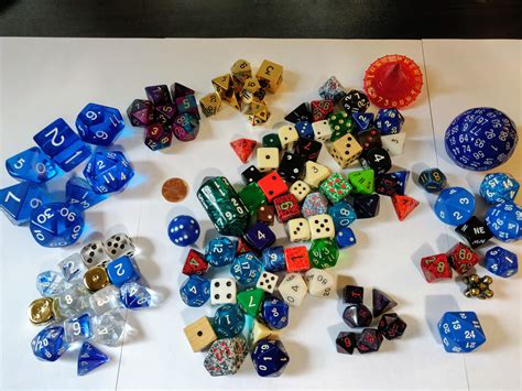 An old and varied collection. Including an ancient TSR die, wood dice, metal dice, a Venetian ...