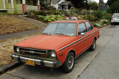 OLD PARKED CARS.: 1979 Datsun 210.