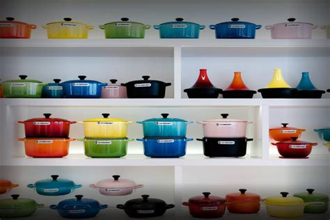 colorful pots and pans on shelves in a kitchen