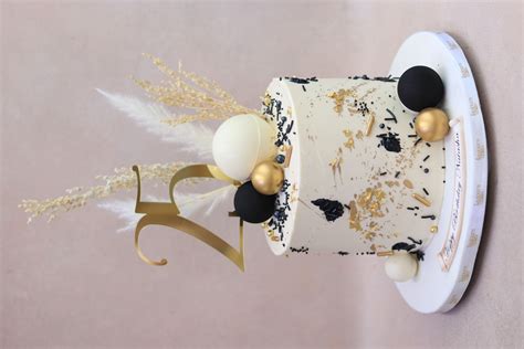 Black white and gold birthday cake with dried stems. Perfect gender ...