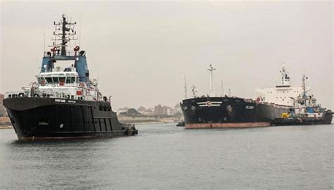 Container ship refloated in Suez Canal after running aground