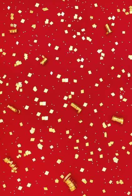 Premium Photo | Gold glitter on red background