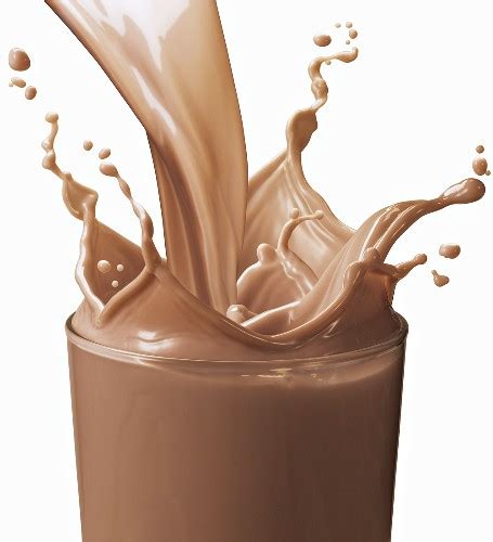 Pouring Chocolate Milk into a Glass; … – License Images – 693960 StockFood