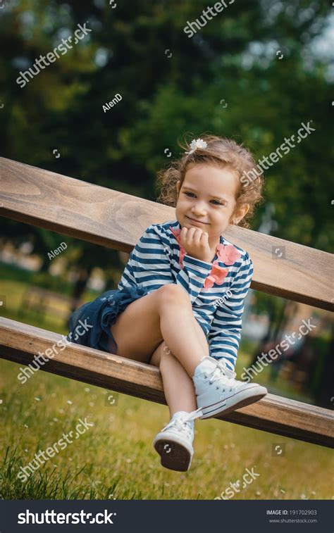 Cute Little Girl Sitting On Bench Stock Photo 191702903 | Shutterstock