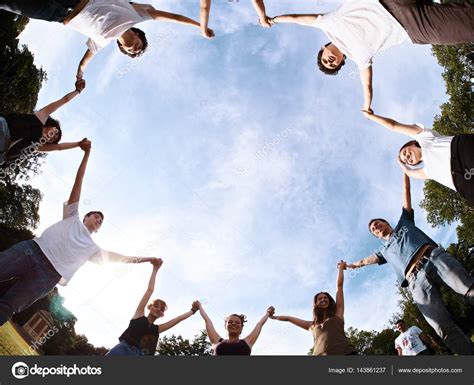 People Holding Hands In A Circle