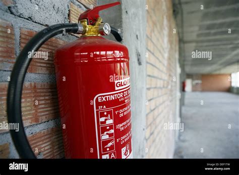 Fire extinguisher, office building under construction Stock Photo - Alamy