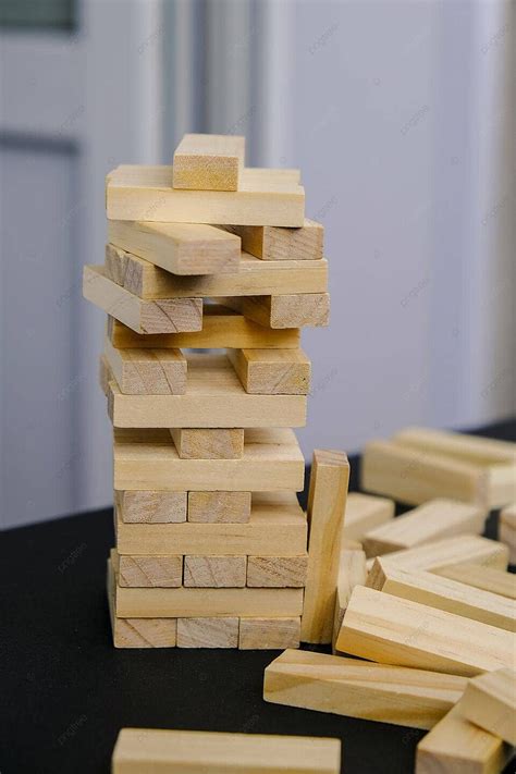 Wooden Block Building Game With Hand And Architecture Model Photo ...