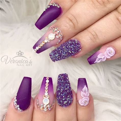 Among all the nail colors purple nails with glitter carry that special vibe that grants your ...