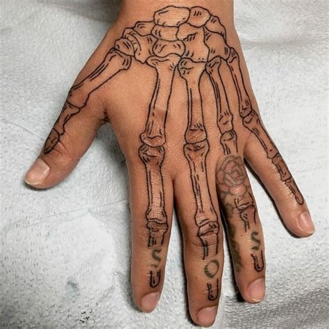 101 Amazing Skeleton Hand Tattoo Ideas That Will Blow Your Mind! - Outsons