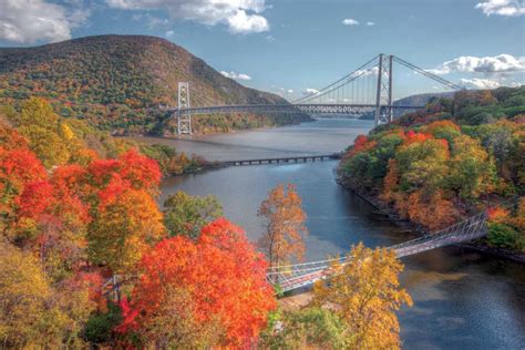 Autumn view of Bear Mountain Bridge with the CSX railroad bridge and the Popolopen Creek ...