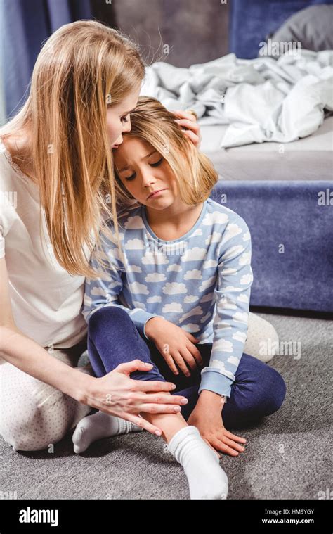 Mother hugging sad daughter Stock Photo - Alamy