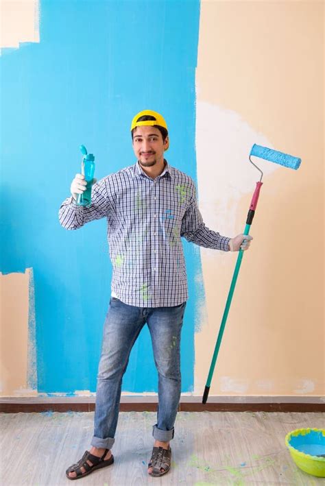 The Painter Man Painting the Wall at Home Stock Photo - Image of paintbrush, improvement: 121684218