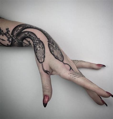 Wonderful Daring Snake Tattoo Design on Hand for Women | Snake tattoo ...