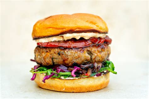 Pink Pepper Pork Burger - Harissa feta sauce and red cabbage slaw