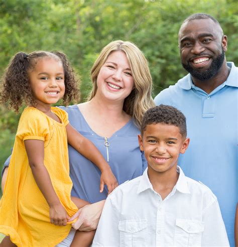 Portrait of a happy mixed race family smiling - Penn Foundation