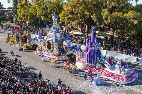 the float is being carried down the street by people in costume and ...