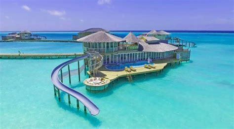 These villas in the Maldives have slides that take you right into the water