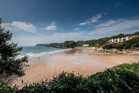 Explore the quiet, historical and sunny beach of Gower, Swansea ...