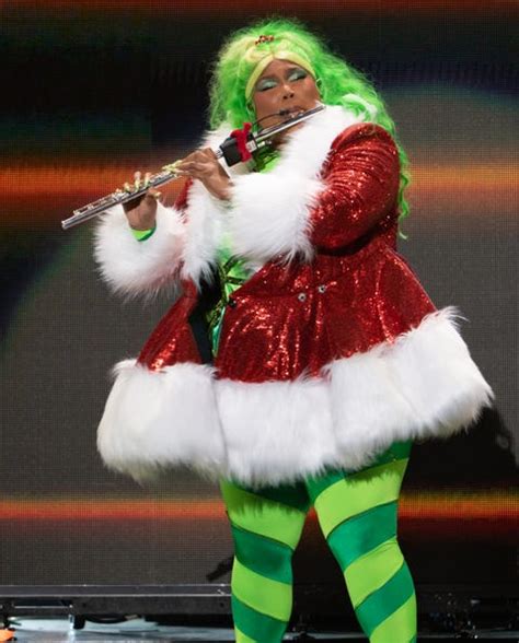 Lizzo is giving sexy Grinch cosplay in NYC in festive look