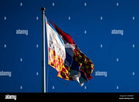 Colourful Flag, flying in the Wind Stock Photo - Alamy