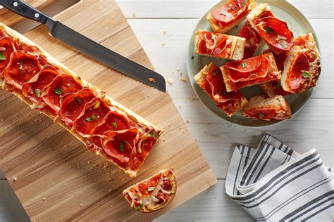 French Bread Pizzas with Mozzarella and Pepperoni recipe | Epicurious.com