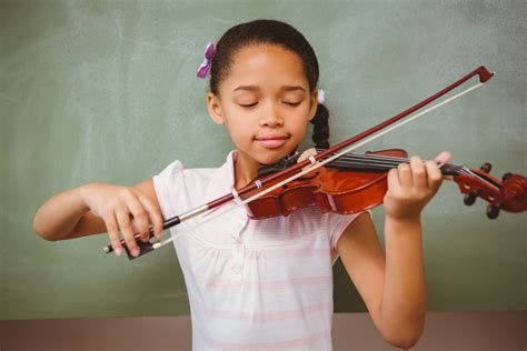 44815613 - portrait of cute little girl playing violin in classroom - So i Heard Music