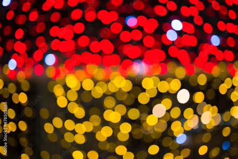 Red golden Christmas lights background with bokeh . Abstract background ...