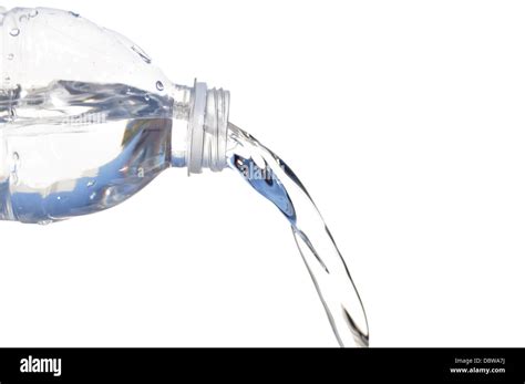 Water pouring out of plastic bottle isolated on White Stock Photo - Alamy