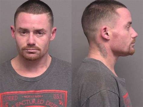 Wrecked car ends up on no-parking sign; Salina man arrested