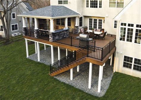 This custom deck and porch showcases TimberTech walnut evolutions ...