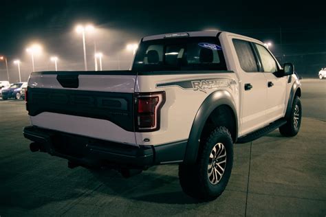 New pickup parked against cars at night · Free Stock Photo