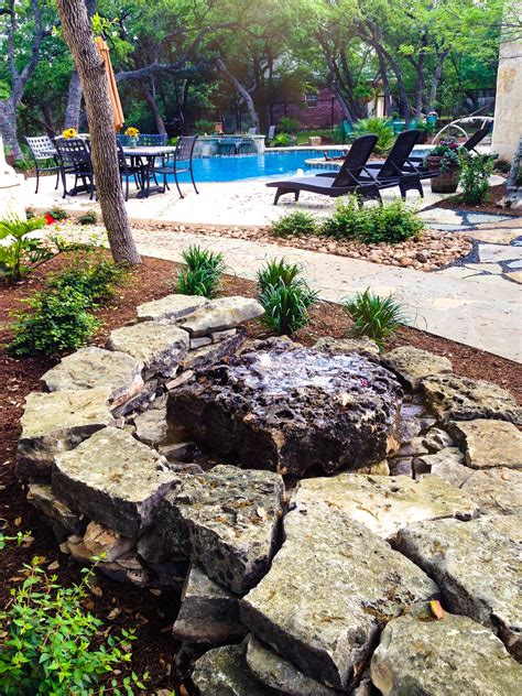 Water Feature in Backyard Oasis | Boulders water feature, Water ...