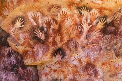 “The Cave of Hands” in Argentina. These Prehistoric rock paintings of human hands were created ...