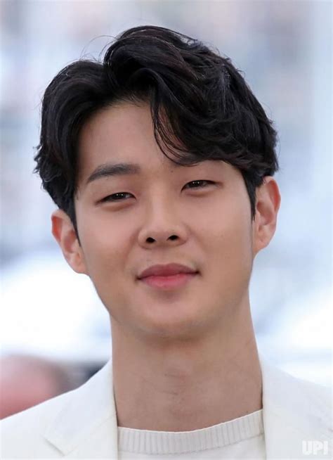 Choi Woo-Shik arrives at a photocall for the film "Parasite" during the 72nd annual Cannes ...