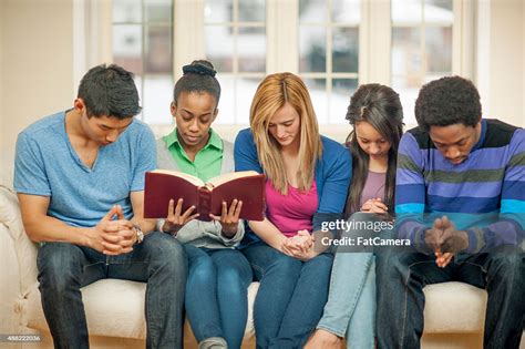 Teenagers Praying At Bible Study High-Res Stock Photo - Getty Images