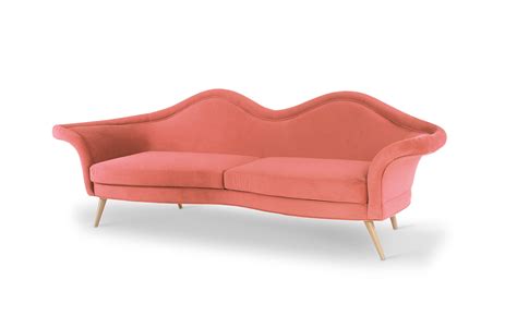 The Jeane Mid-Century Modern Sofa seductive top rests on an extravagant yet elegant polished ...