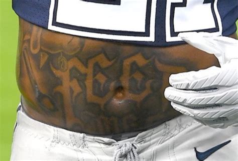 Ezekiel Elliott has a very appropriate 'feed me' stomach tattoo