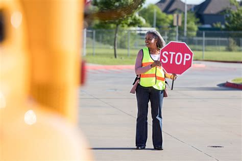 Crossing Guard With Stop Sign Stock Photo - Download Image Now - iStock