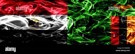 Egypt, Egyptian vs Zambia, Zambian smoke flags placed side by side. Thick abstract colored silky ...