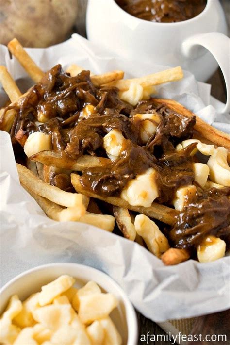 Poutine - A delicious, classic Canadian dish made from French fries, cheese curds and gravy ...